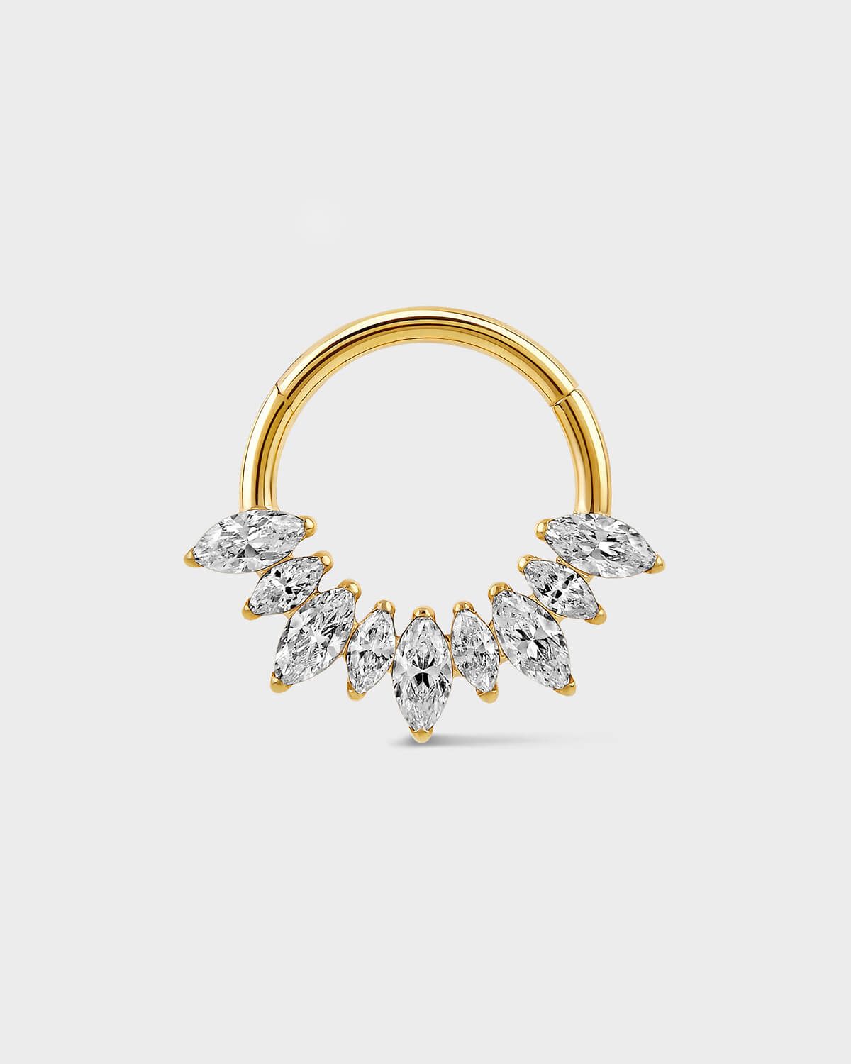Gold titanium daith ring with alternating graduated marquise gemstones on a light gray background.