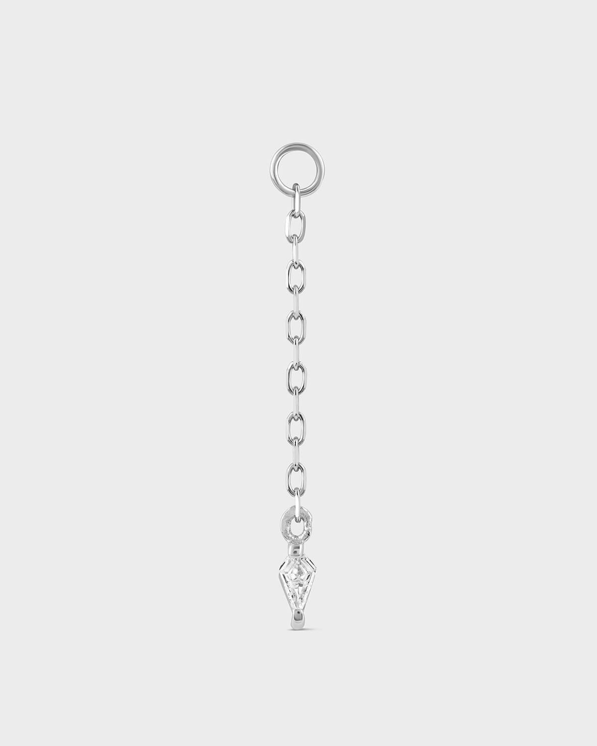 Silver chain with a key-shaped pendant on a light gray background