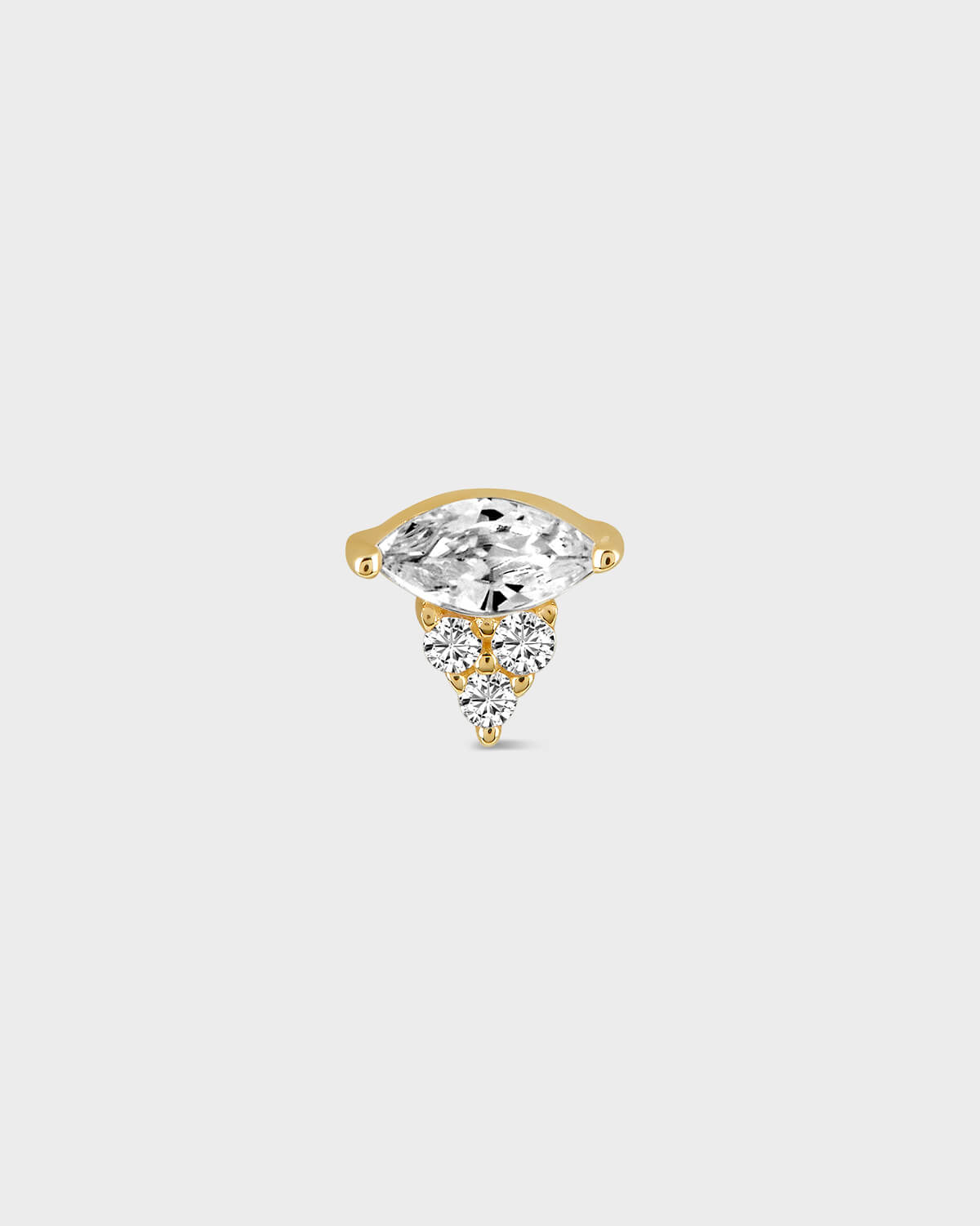 Gold and earring with a central diamond and smaller stones on a light gray background