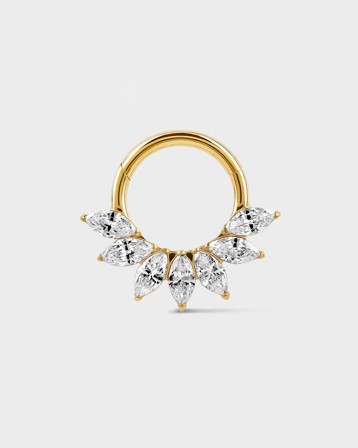 Daith Septum ring in gold titanium with seven marquise gemstone in a fan formation on a light gray background