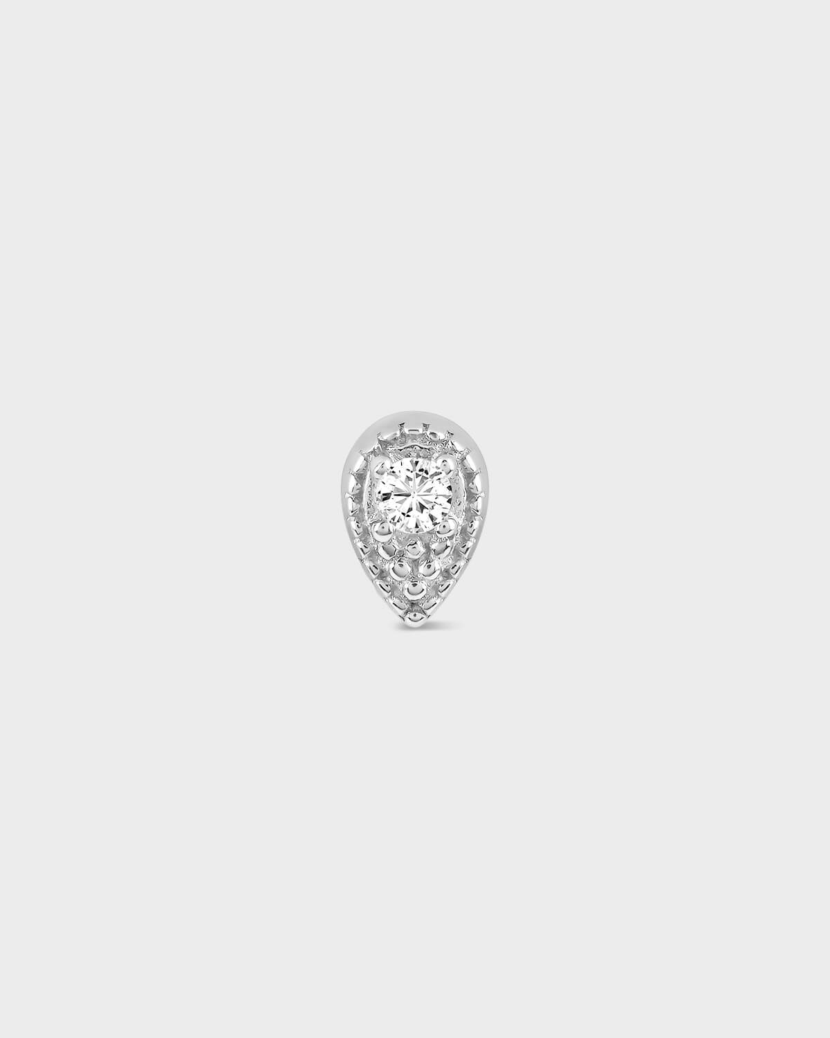 Teardrop-shaped diamond earring on a light gray background