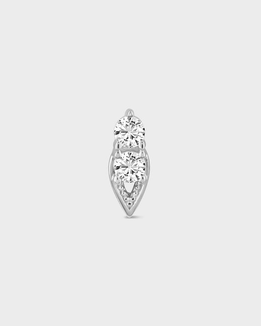 Diamond earring on a light gray background