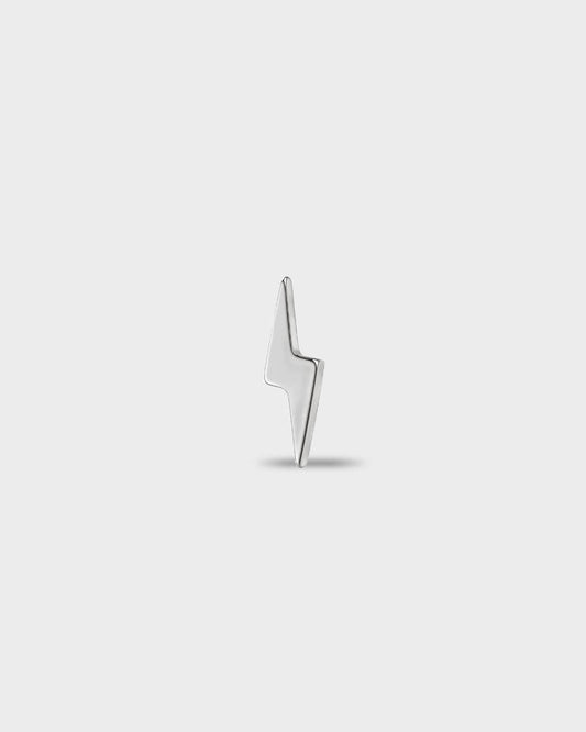Polished titanium earring with a polished lightning bolt shape, on a light gray background.