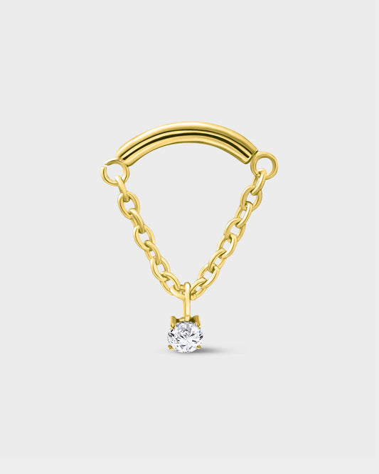 24k gold PVD titanium earring used for hidden helix or hidden rook featuring a smooth curved bar with a chain connected at each end and a single clear solitaire pendent on a light grey background.