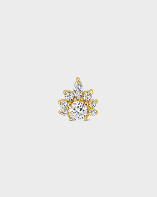 Gold earring with clear gemstones on a light gray background