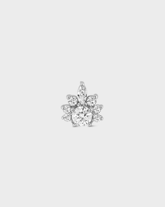 Silver earring with clear gemstones on a white background