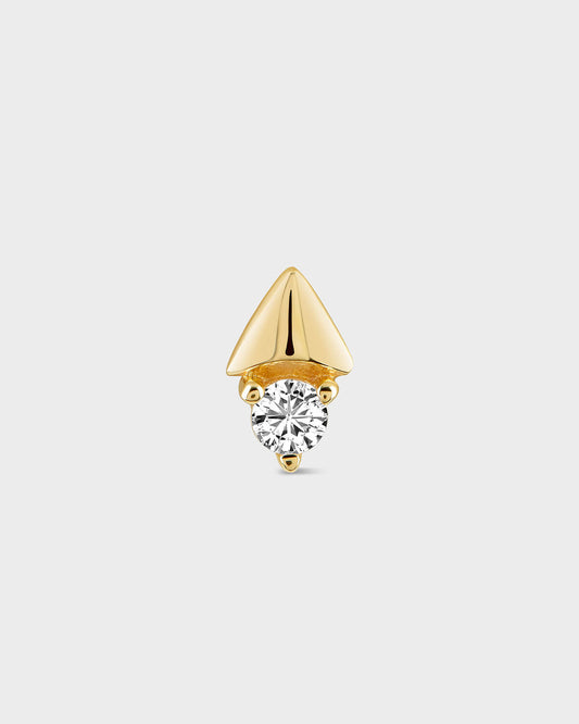 Gold earring with a clear gemstone on a light gray background