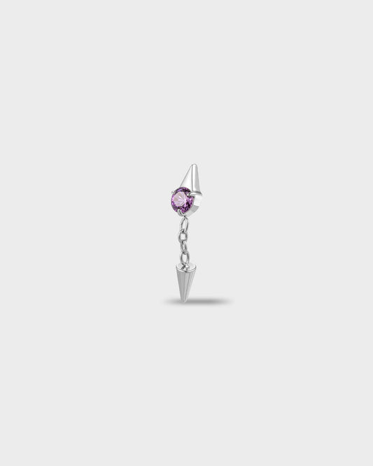 Polished titanium earring with a round-cut amethyst purple stone and a short chain dangle finished with a polished spike, on a light gray background.