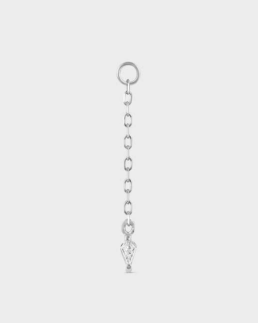 Silver chain with a key-shaped pendant on a light gray background