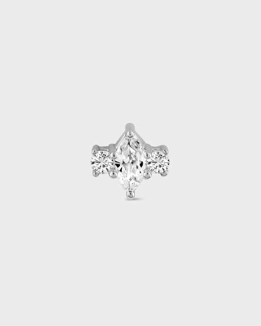 White gold earring with a central clear marquise gemstone and two round gems either side on a light gray background