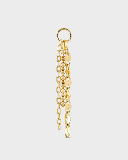 Gold chain earring on a light gray background