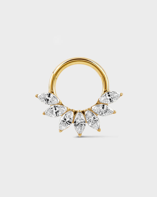 Daith Septum ring in gold titanium with seven marquise gemstone in a fan formation on a light gray background