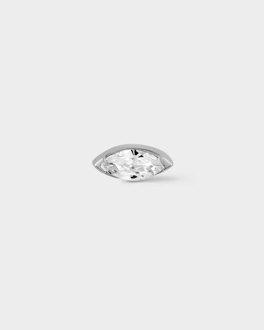 White gold earring with marquise gem on light grey background
