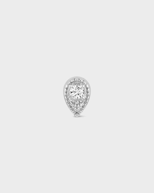 Teardrop-shaped diamond earring on a light gray background