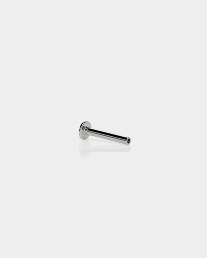 Threadless titanium labret back in polished silver with a 3mm base and 16g shaft on a light gray background