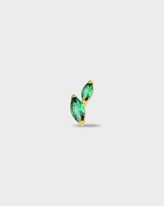 Gold titanium earring with two marquise-cut emerald green stones set in a curved vertical arrangement on a light gray background.