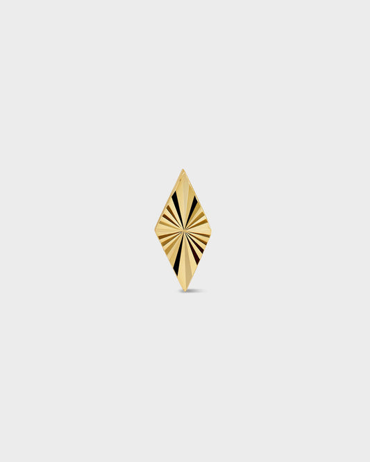 Diamond shape gold earring with laser engraved lines on a light ray background