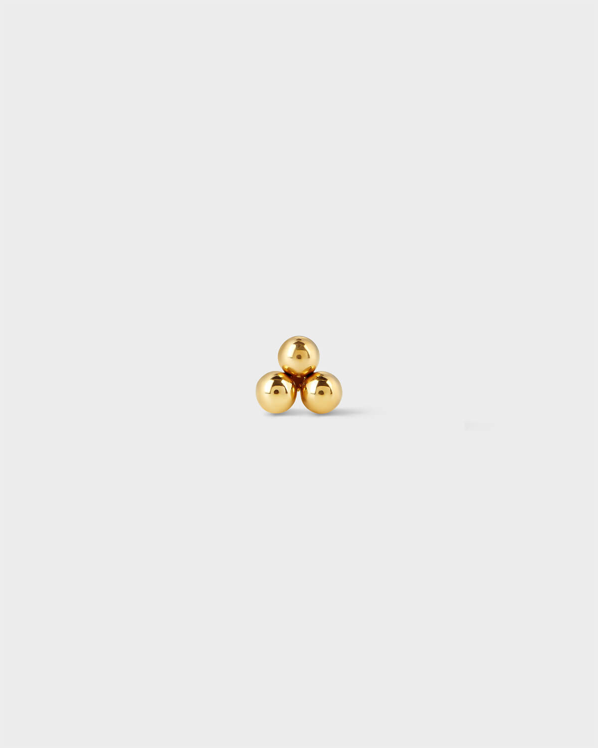 Titanium threadless end featuring a polished three-bead cluster in a minimal triangular arrangement.