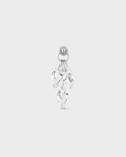 Silver earring with clear gemstones on a light gray background