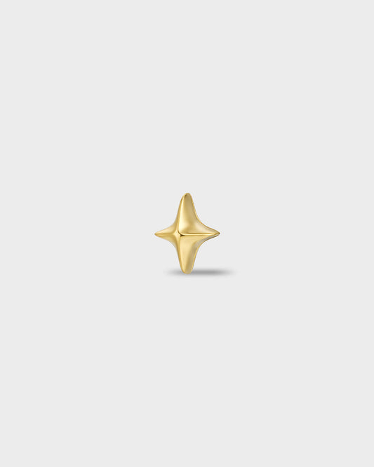 Gold titanium earring with a polished four-point star shape on a light gray background.